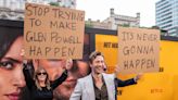 Glen Powell’s Parents Showed Up on His Red Carpet With Signs Trolling Him: ‘Stop Trying to Make Glen Powell Happen’ and ‘It’s...