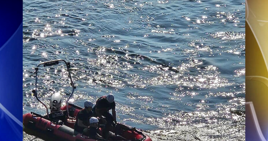 Sand Springs Fire Dep. rescues woman holding onto a floating branch in the Arkansas River