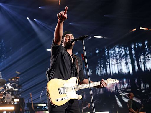 Luke Bryan Jokes with Fan After Tripping on a Cellphone on Stage: 'My Lawyer Will Be Calling'