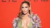 Jennifer Lopez Takes the Plunge in a Dreamy Dress and Floral Feathered Cape at Elie Saab Show in Paris