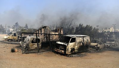 One dead and homes burnt to ground as fires die down in Greece