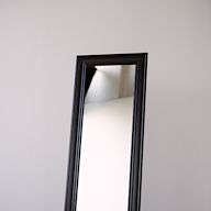 Full-length mirrors that stand on the floor, providing a head-to-toe reflection.. Commonly used in bedrooms or dressing areas.