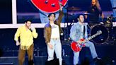 The Jonas Brothers tour brought the hits and a song for a newly engaged couple to Phoenix