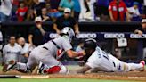 Marlins break up no-hitter in seventh, rally to force extras, still get swept by Red Sox