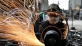 China Dec factory activity extends declines on COVID surge - Caixin PMI