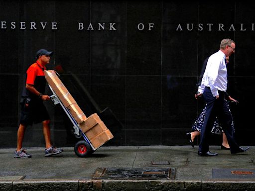 Australia's central bank says policy is restrictive, causing households pain