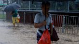 WRAPUP 4-Hong Kong, Shenzhen deluged by heaviest rain on record