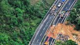 Highway collapse in China kills at least 36 people as cars sent crashing down into pit