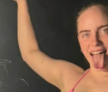 Billie Eilish puts on a very busty display in a RARE bikini snap