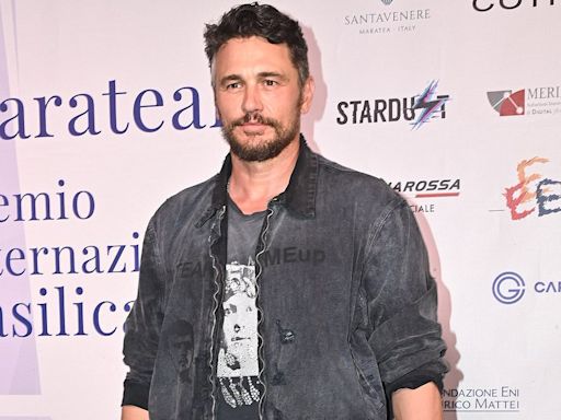 James Franco accepts an award in Italy in a denim jacket and jeans