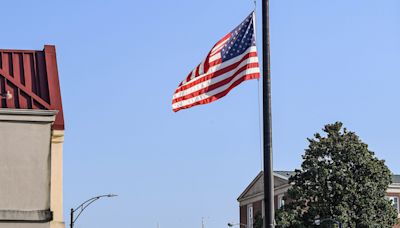 Why are flags flying at half-staff in South Carolina?