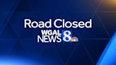 Downed tree closes road