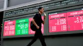 Stock market today: With US markets closed, Asian shares slip and European shares gain