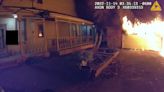 Wisconsin police officer alerts residents to garage engulfed in flames next to houses during night shift