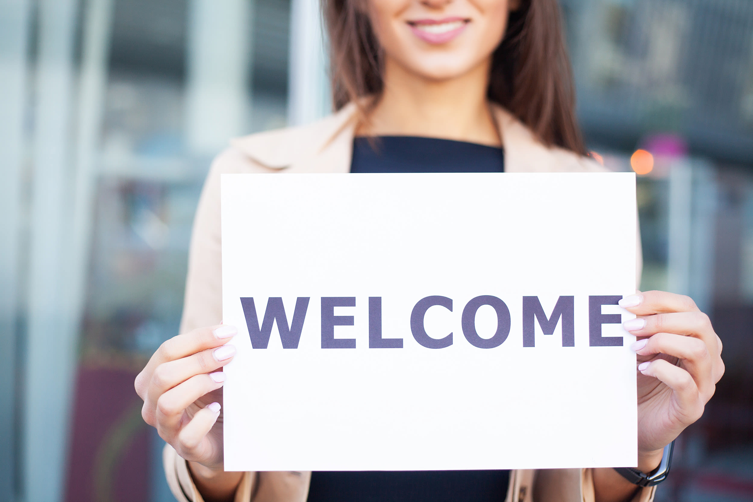 Man so invested in stranger's airport sign he refuses to go home