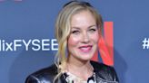 Christina Applegate says a crew member on 'Dead To Me' had to hold her legs off camera during some scenes to make sure she didn't fall