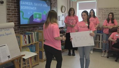 Hermon High School students teach fourth graders about financial literacy