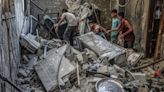 Dozens of bodies found in Gaza rubble as ceasefire negotiations continue in Egypt