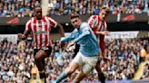 Soccer-Toney strikes twice as Brentford stun Man City