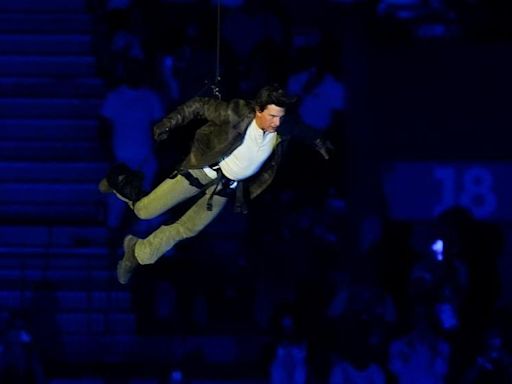 Tom Cruise abseils off stadium roof in daring Olympic finale