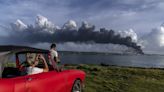 Firefighters battle big blaze at Cuba oil tank farm for 2nd day