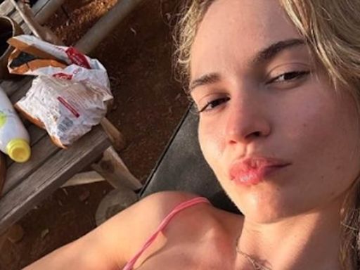 Lily James flaunts her incredible figure in a high cut-pink swimsuit