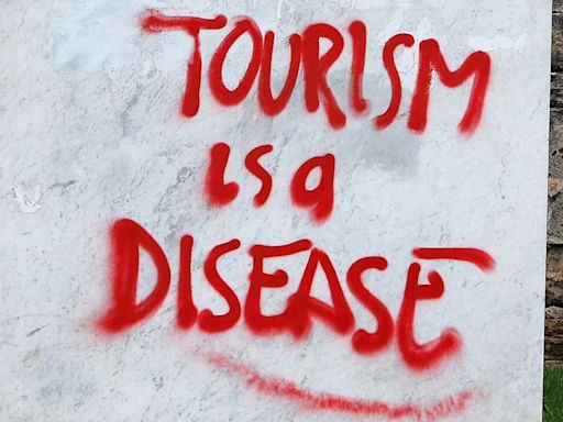 'It's Tourist Hunting Season': The Street Art That's Seething About Mass Tourism