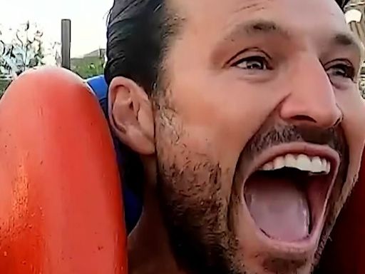 Mark Wright screams as he takes DJ Toby Anstis on slingshot ride