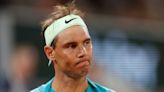 French Open day two: Rafael Nadal makes early exit but Iga Swiatek progresses