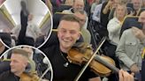 Irish folk singer whips out fiddle on flight, entertains passengers: video