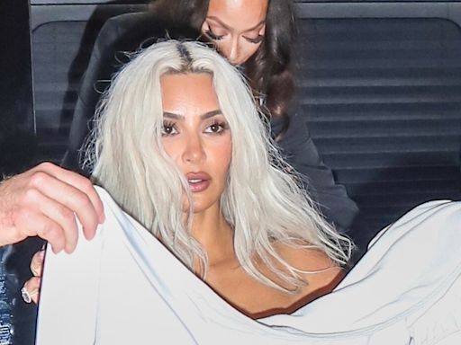 Kim Kardashian hides under sheet as she leaves Met Gala after backlash