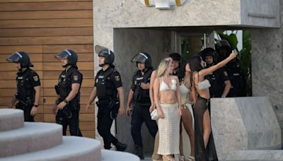 Moment riot cops raid Costa del Sol club packed with tourists in crackdown