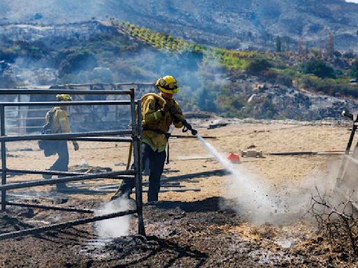 Weather shift gives firefighters an edge in battling three large Southern California wildfires