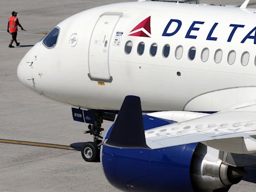 Delta Air Lines says cancellations continue as it tries to restore operations after tech outage