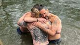 Russell Brand shares new picture embracing Bear Grylls during River Thames baptism