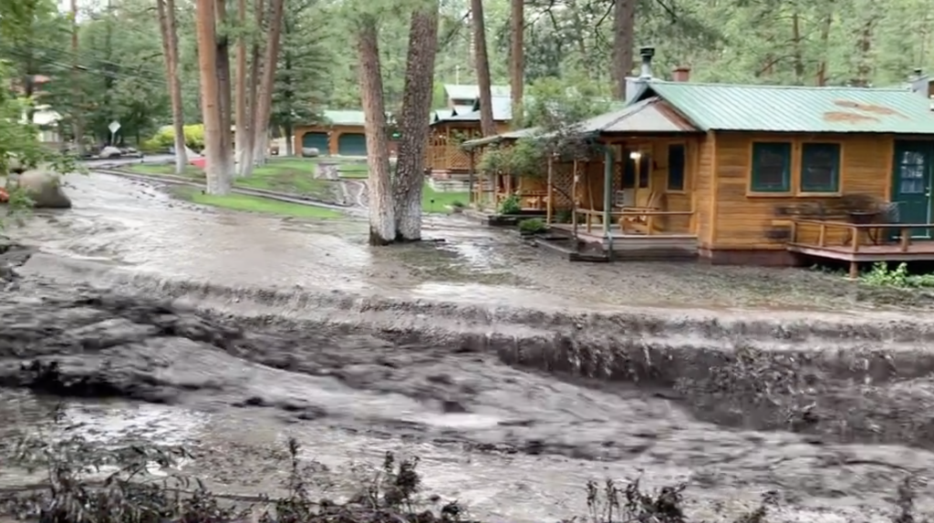 Woman trapped in tree, bridge destroyed, landspout in 'extreme' Ruidoso burn scar flooding