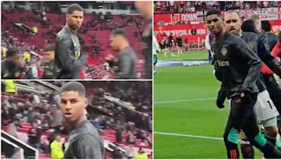 Marcus Rashford pulled away by teammates after row with Manchester United fan in stands