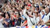 Fans celebrate as Bellingham helps England to dramatic comeback victory at Euros
