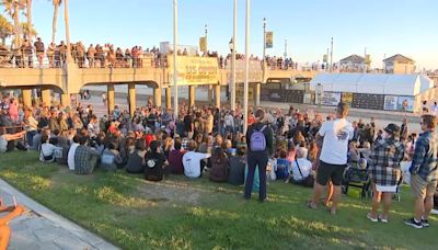 Vigil held for missing Huntington Beach swimmer as Coast Guard calls off search