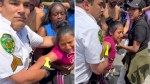 Chaotic video shows NYC Parks employee cuff girl, 14, selling fruit with family as bystanders try to pull her away