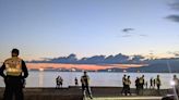 Vancouver police criticized for enforcing liquor laws by clearing English Bay beach at sunset