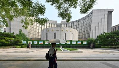 China central bank cuts two key rates to support flagging economy