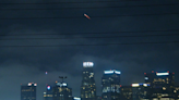SpaceX rocket loaded with spy satellites seen over downtown L.A.