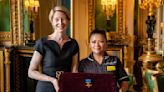 Filipina nurse receives George Cross from Queen Elizabeth