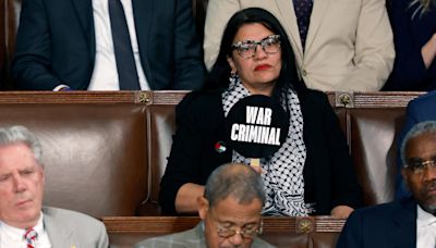 Rep. Rashida Tlaib holds "war criminal" sign during Benjamin Netanyahu's speech to Congress