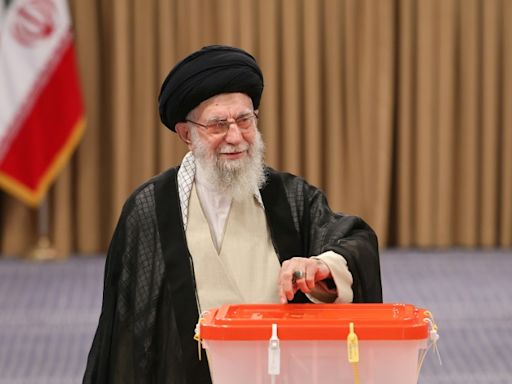 Calling for better ties with West, Iran reformist wins presidency