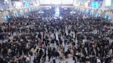 China plays down COVID outbreak with holiday rush at full tilt