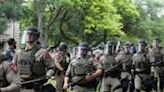 Texas state troopers walk on the campus of the University of Texas as pro-Palestinian students protest the Israel-Hamas war in Austin on April 24, 2024