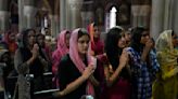 Pakistan hands out cash to Christians who lost homes in rioting over alleged desecration of Quran
