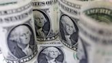 Dollar slips before Fed meeting statement